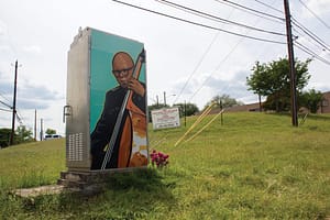 Landscape image of Truth's mural of Draylen Mason on side of electrical box in East Austin, TX.